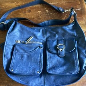 Shoulder bag w/2 zippered sections, 4 outside pockets